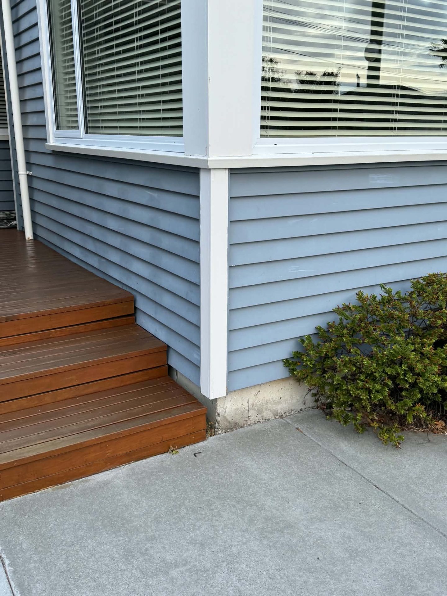 White weatherboard entry steps and deck