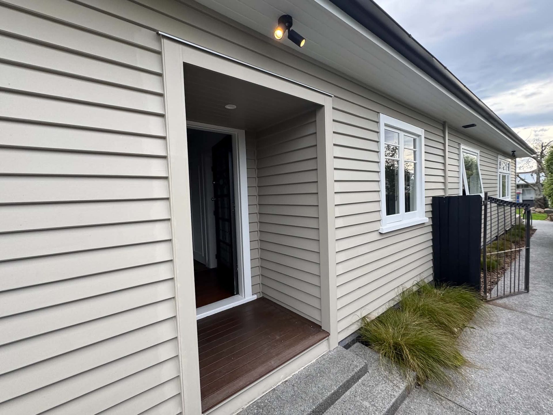 Grey weatherboard home exterior and entryway